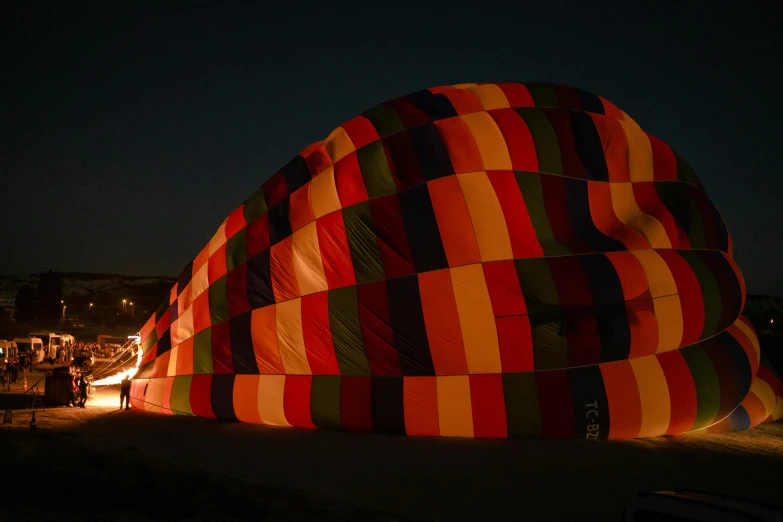 a giant inflated item sitting in the dark