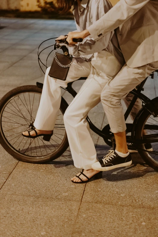 an older woman putting on a jacket while riding a bike