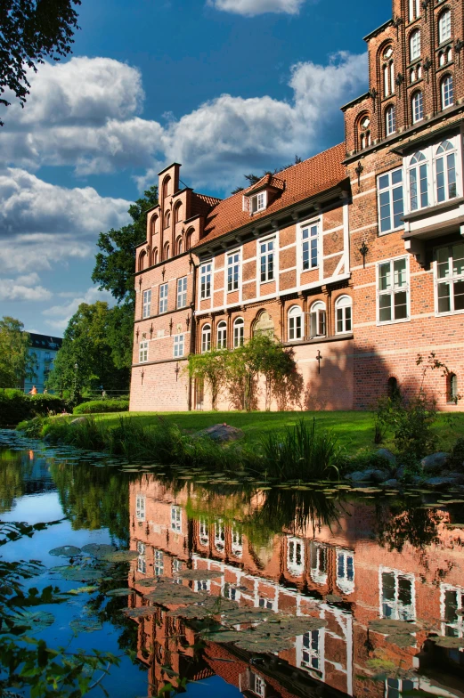 a building with several windows near a body of water