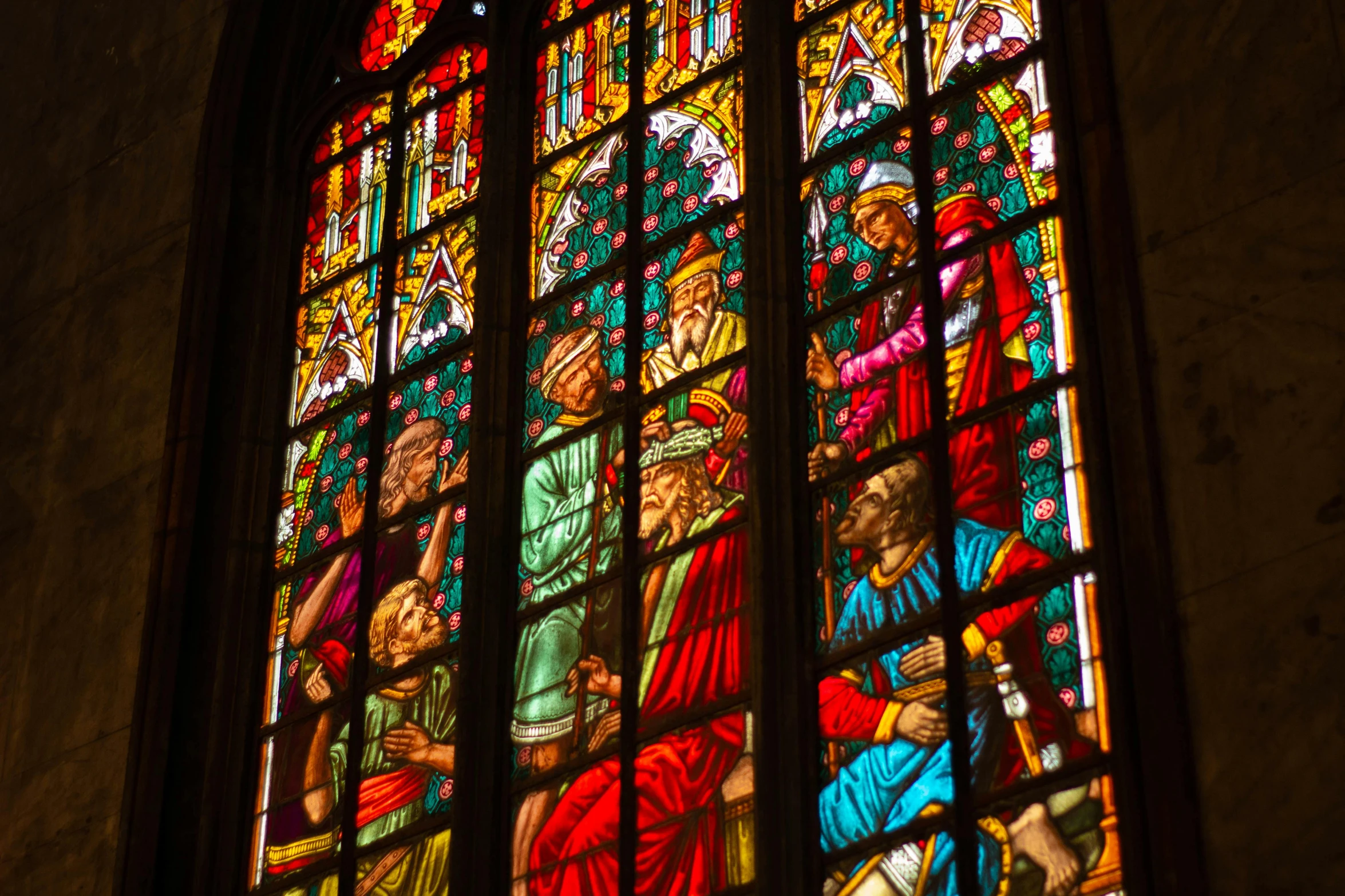 a large stained glass window with lots of colorful light