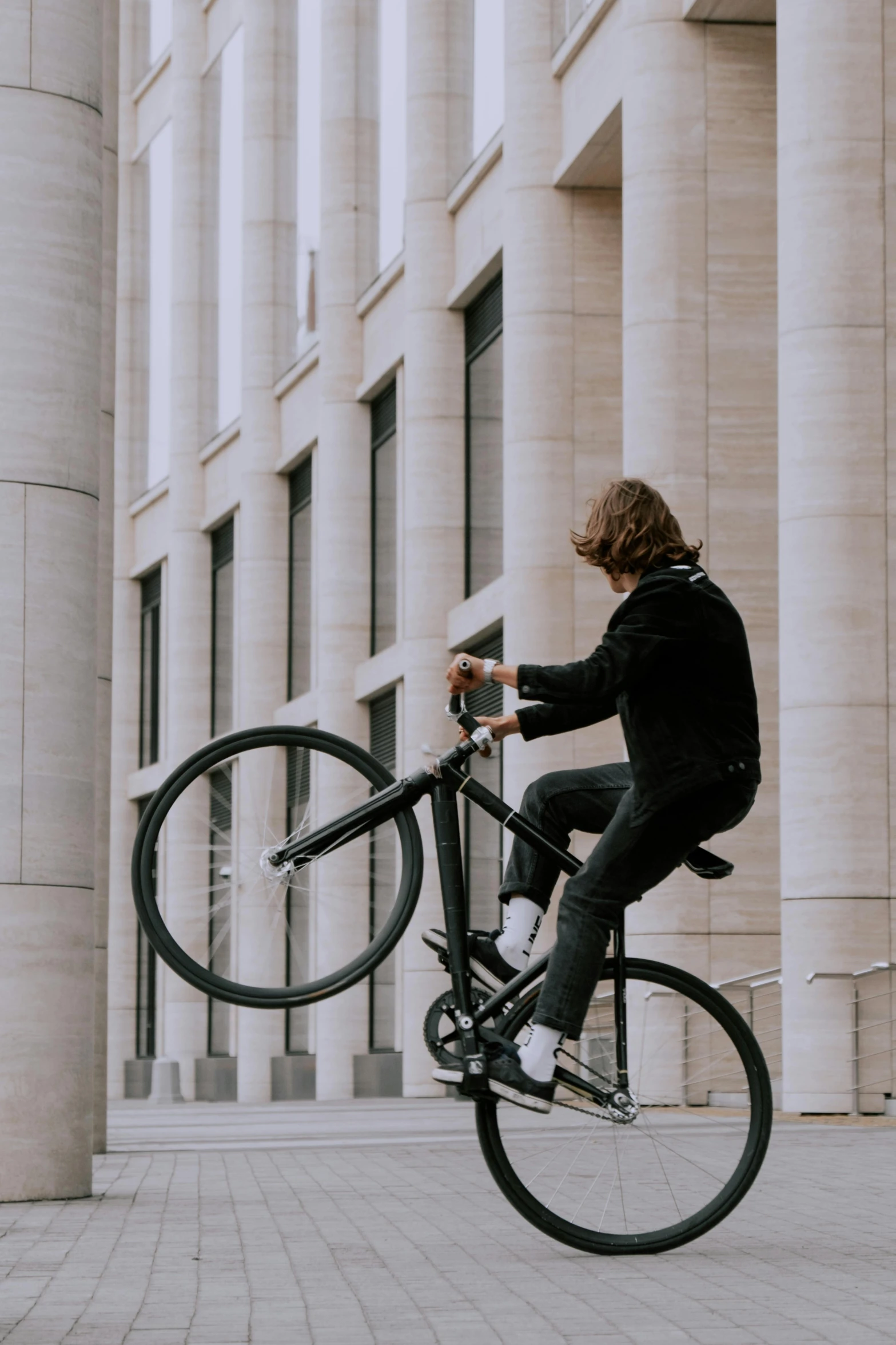 a person that is doing a trick on a bike