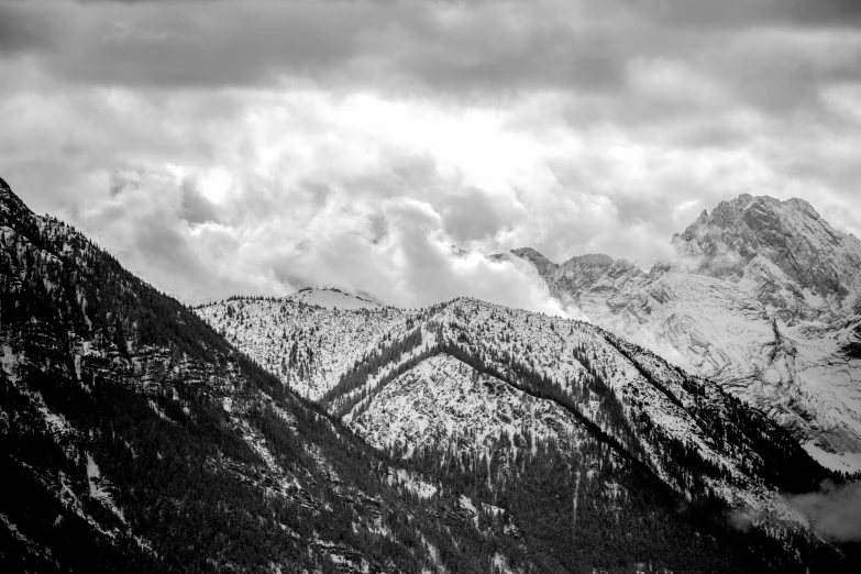 two snowy mountains with snow on them