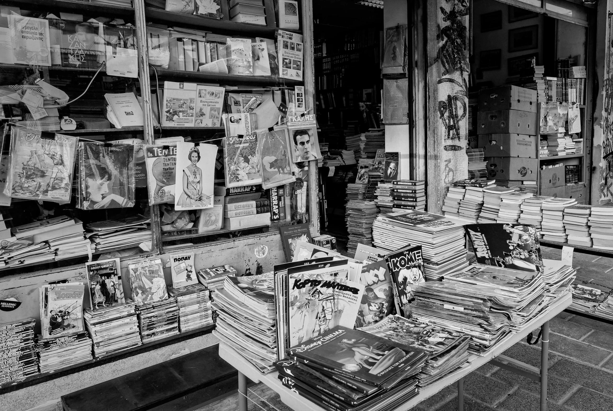 a store filled with books and magazines under a dark sky