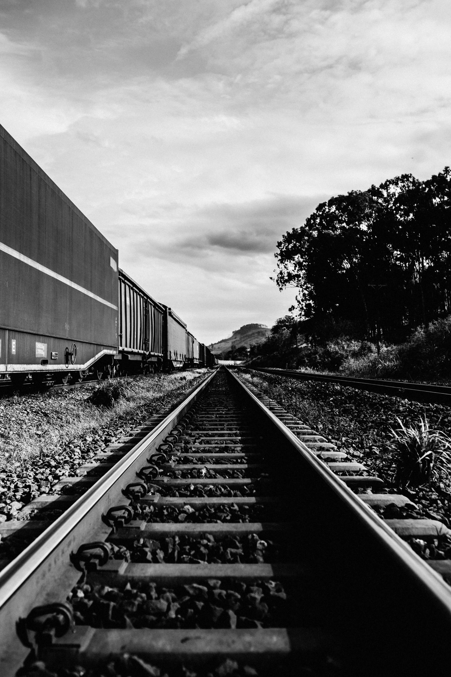 a train on a track with sky in the background