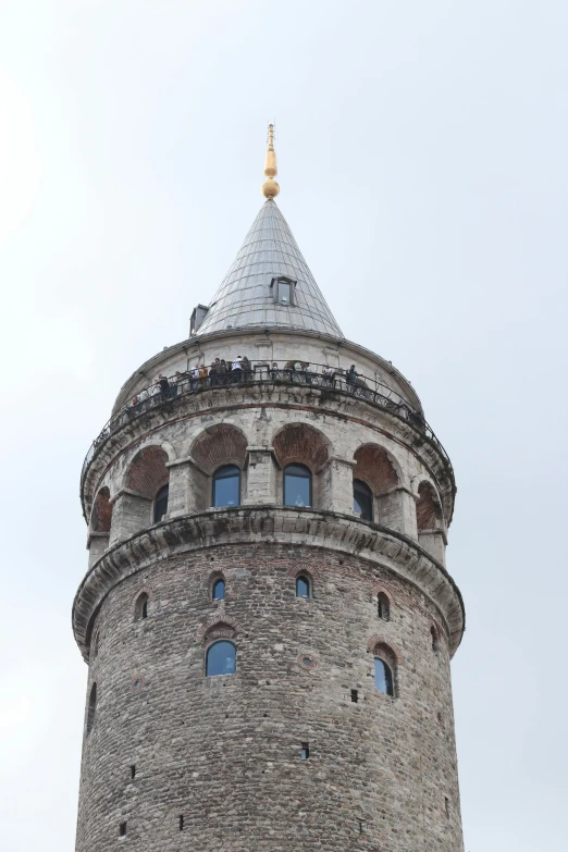 a tall brick tower with a sky background