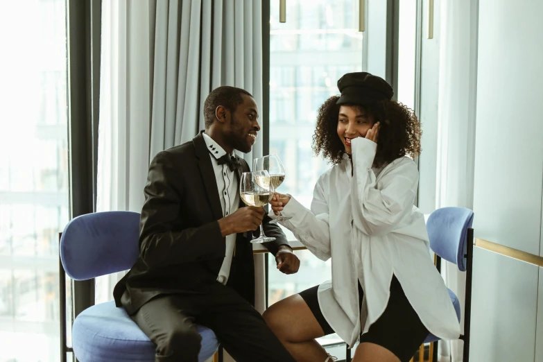 man and woman having drinks at a party