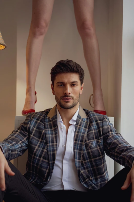 man sitting on a chair posing for picture