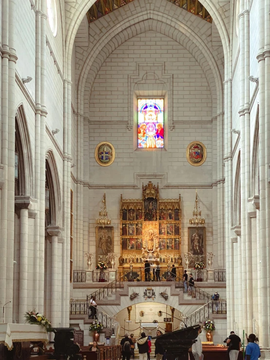 there are people inside of the church walking down the steps