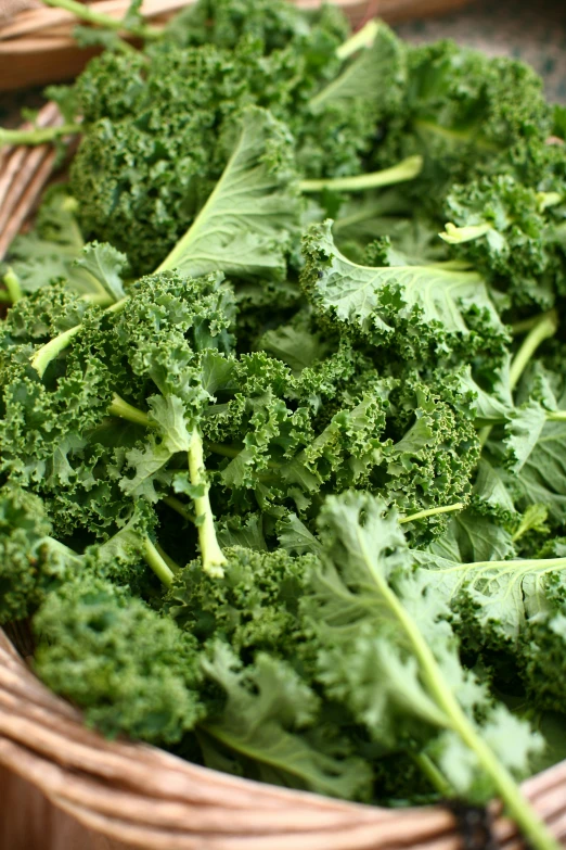 a close up of a basket of broccoli