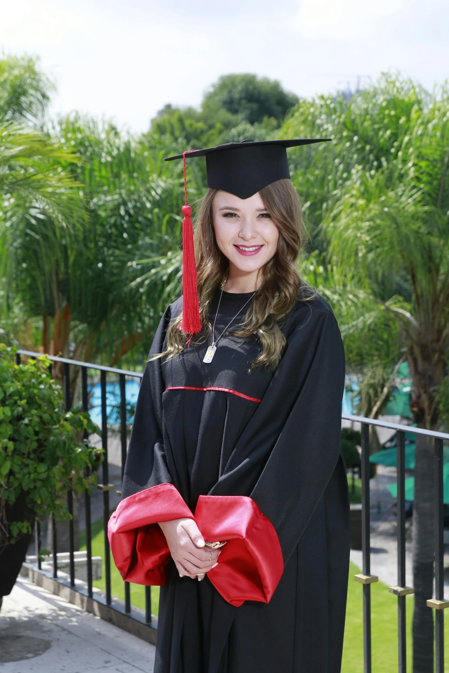 a  posing for a po in her graduation gown