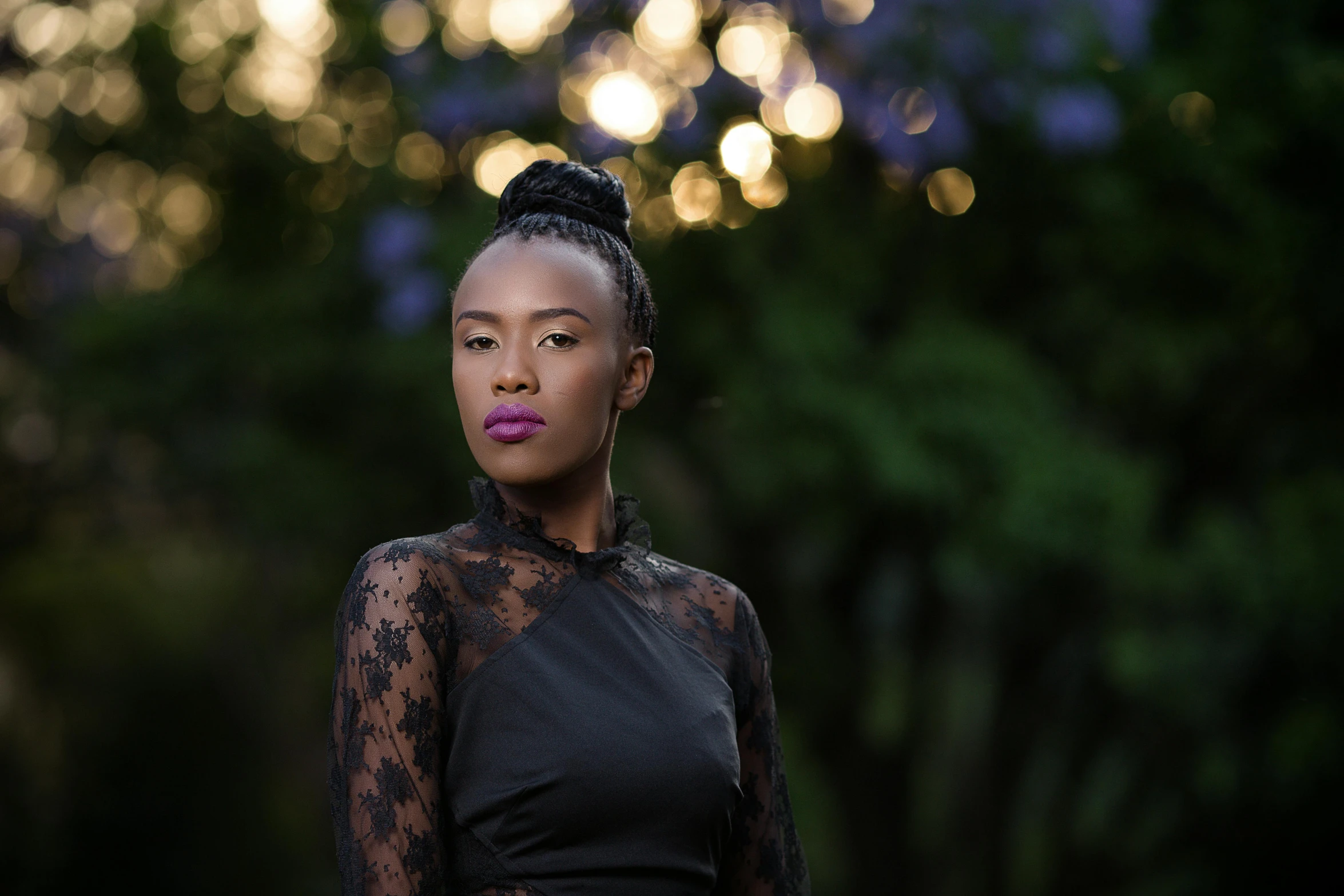 a young black woman with her pink lipstick on