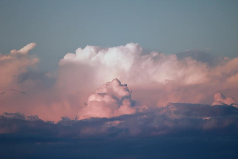 clouds with pink and white colors as seen from the ground