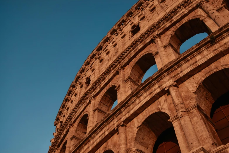 the side of an old roman amphite with three arched windows