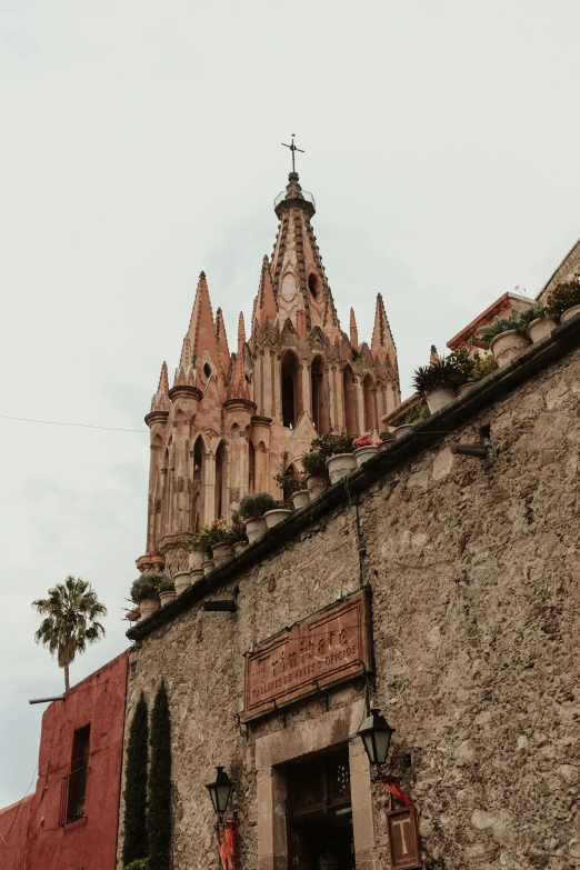 tall church tower sitting on top of a stone building