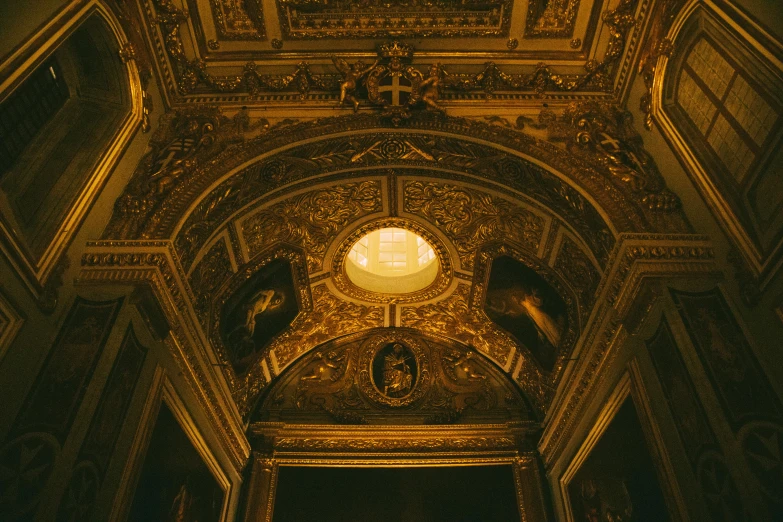 an old building with a very old clock on the ceiling