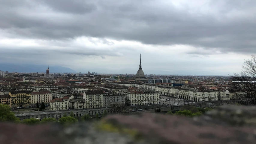 a view of the city in the distance with clouds