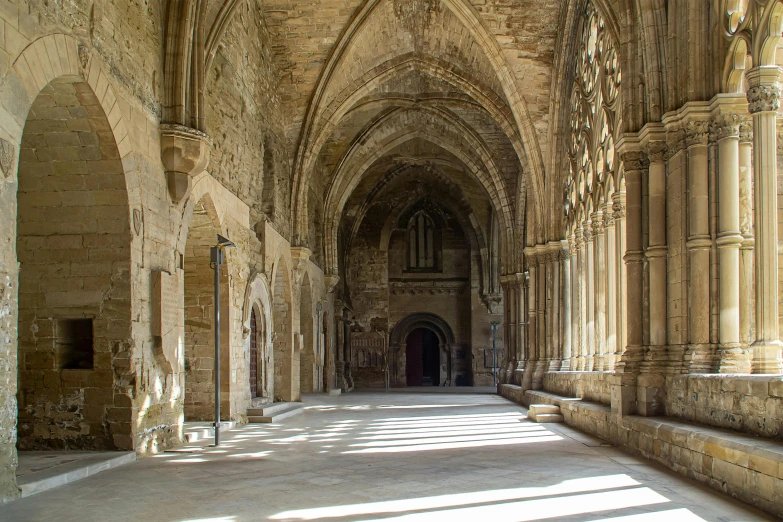 the interior of an old and large church with exposed beams