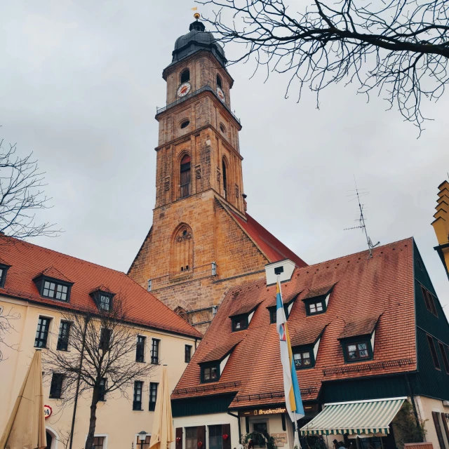 a tall clock tower with several large windows