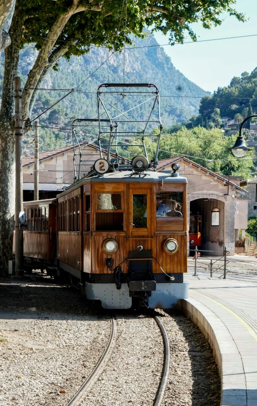 a old train rides by the tree outside