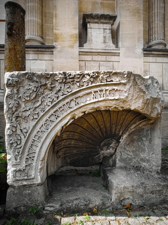 an old stone arch sitting under two pillars