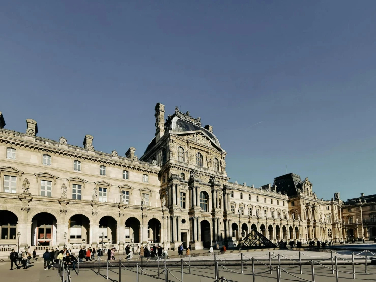 a large building with many windows and stonework on it