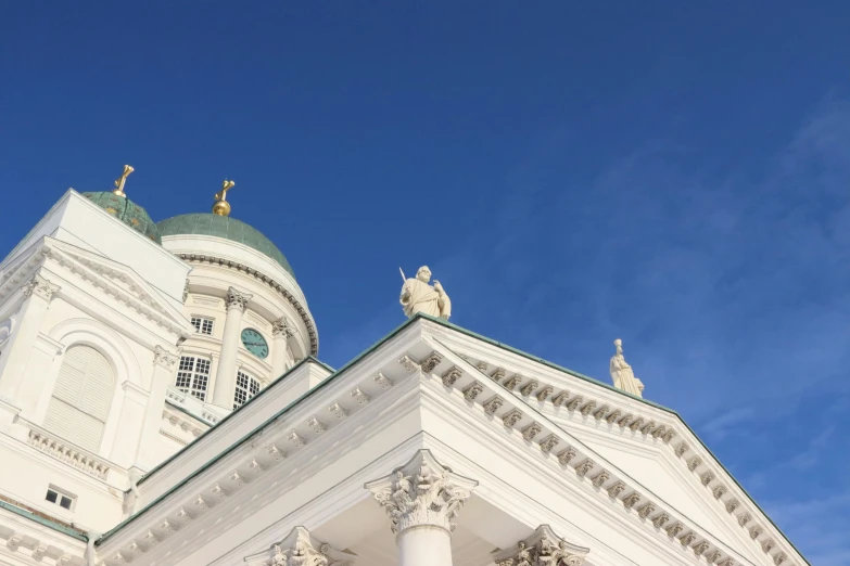 the white building has columns around it