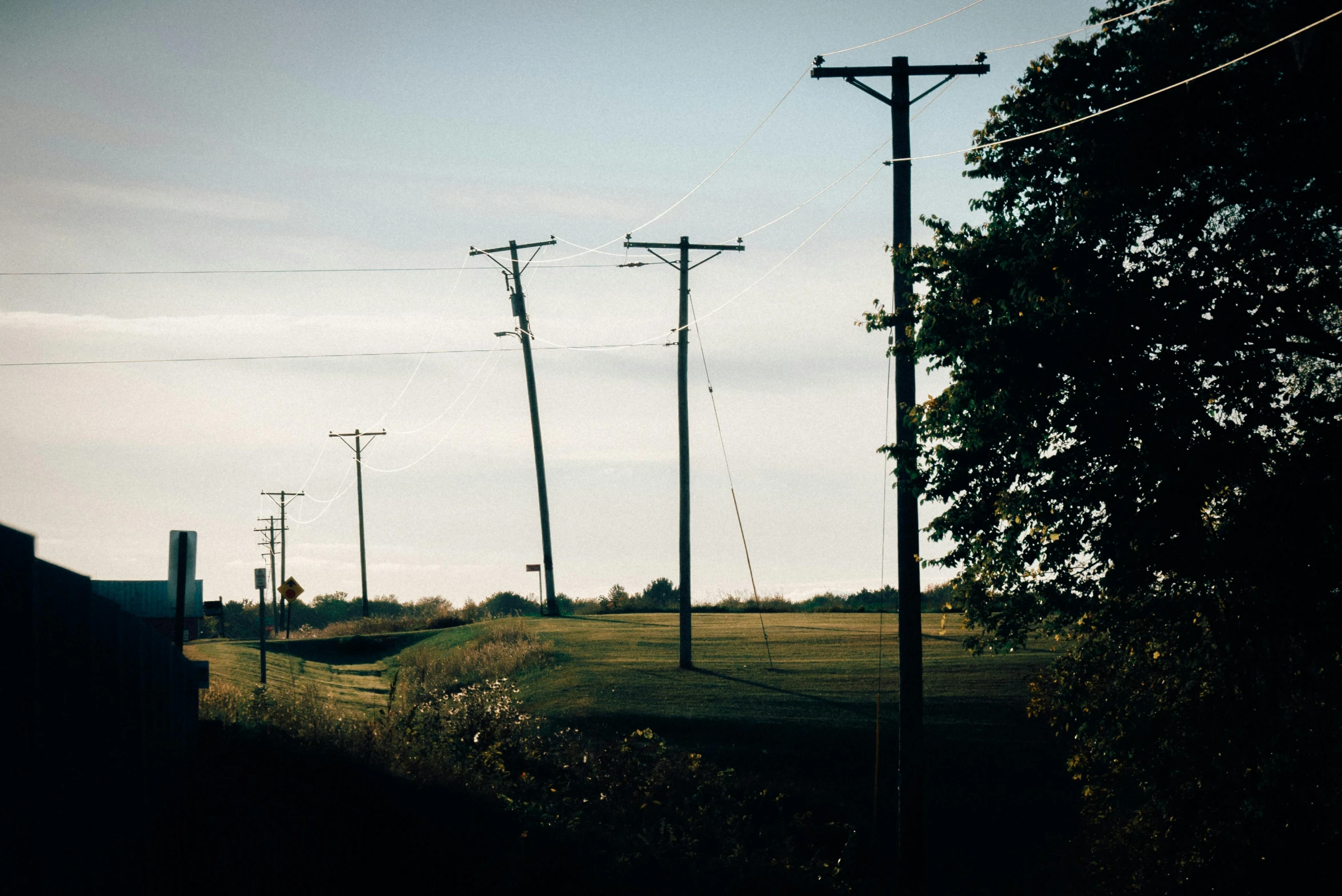 the power lines are in front of a road