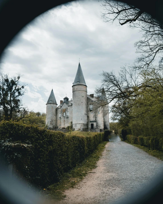 a castle is seen through an old looking camera