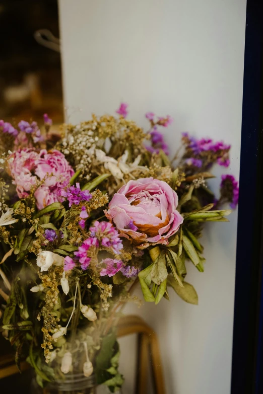 a bunch of flowers sitting in a vase