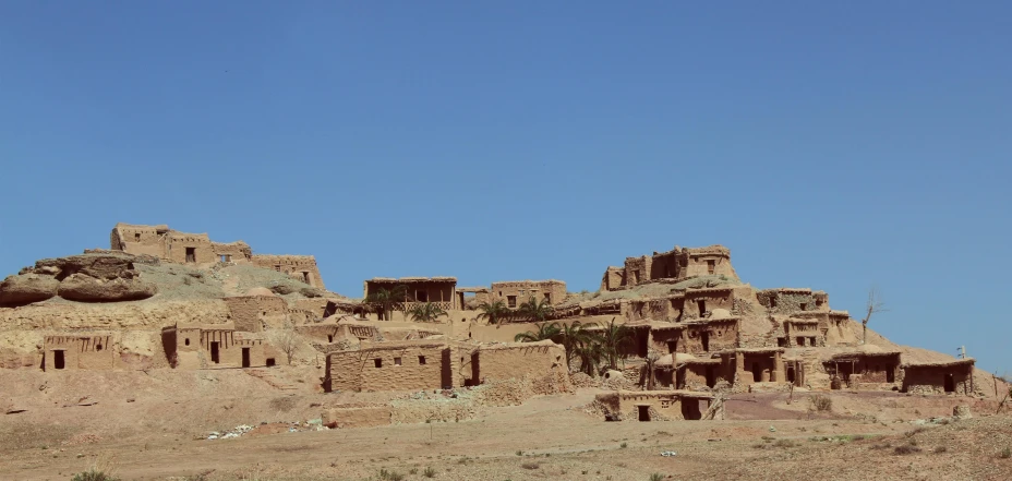 an old desert town with numerous adobe buildings