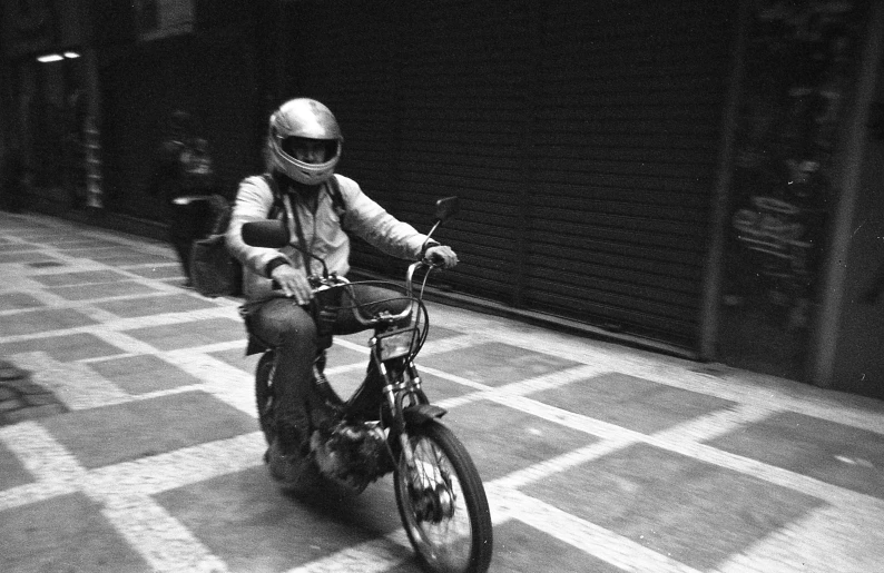 a man that is riding a bike on some concrete