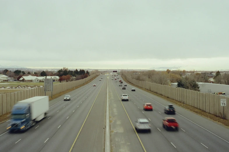 multiple traffic on highway with mountains in background