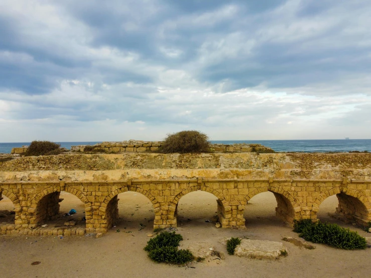 an image of the old bridge over the beach