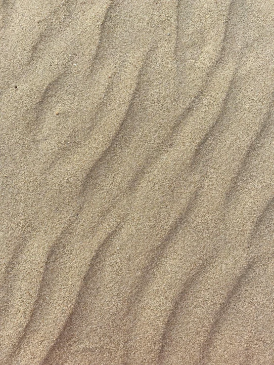 sand patterns and lines in a smooth, sandy area