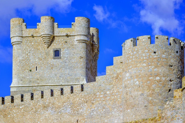 two towers on a castle on a clear day