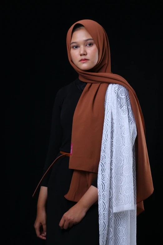 young woman wearing brown shawl and lace shawl