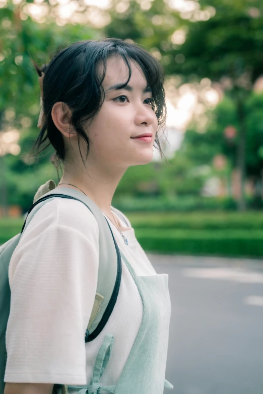 woman standing in the road wearing an apron