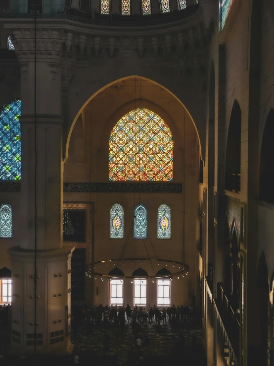 a stained glass window in the center of a building