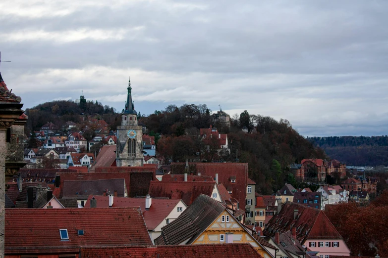 view from top of a building of red roofs and spires