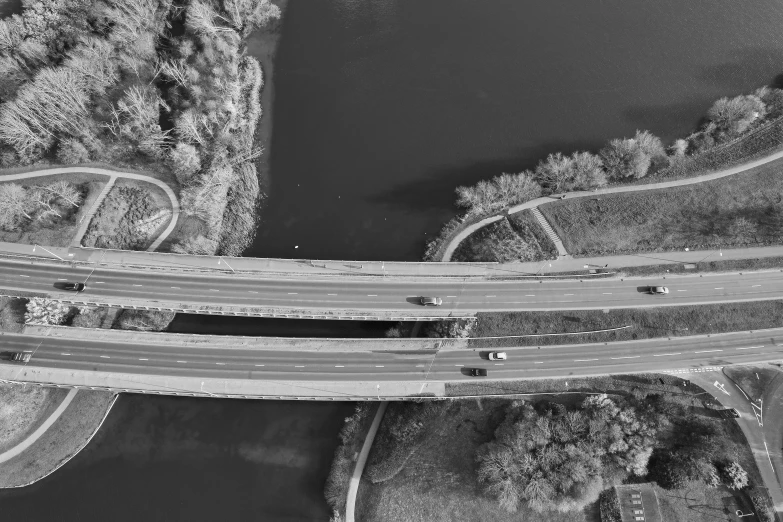 two streets are suspended over a bridge and a road