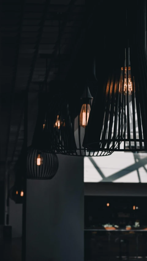 light bulbs hanging from a ceiling in a restaurant