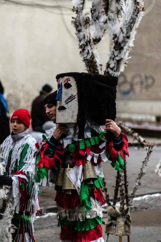 a person dressed in costume standing by some trees