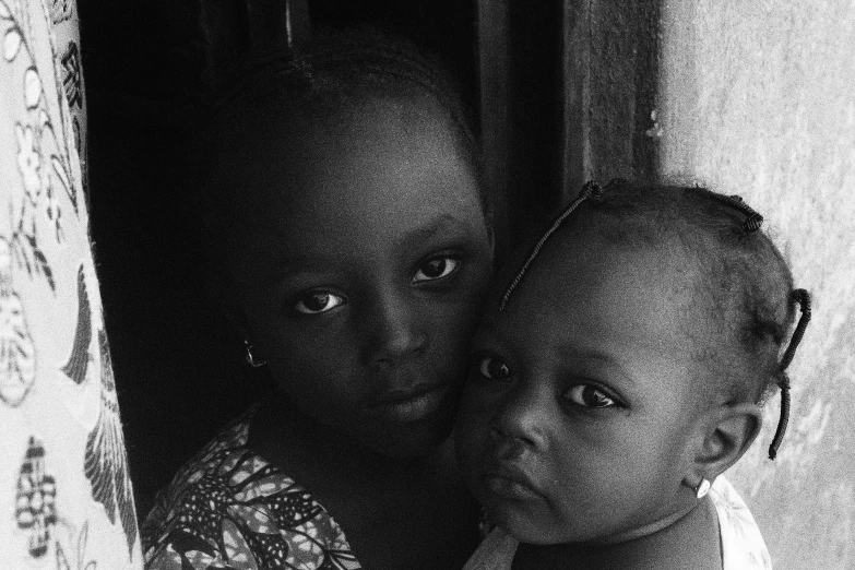 black and white pograph of children in a dark room