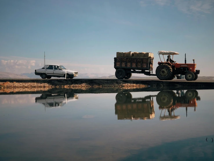 some trucks are parked on the side of a road