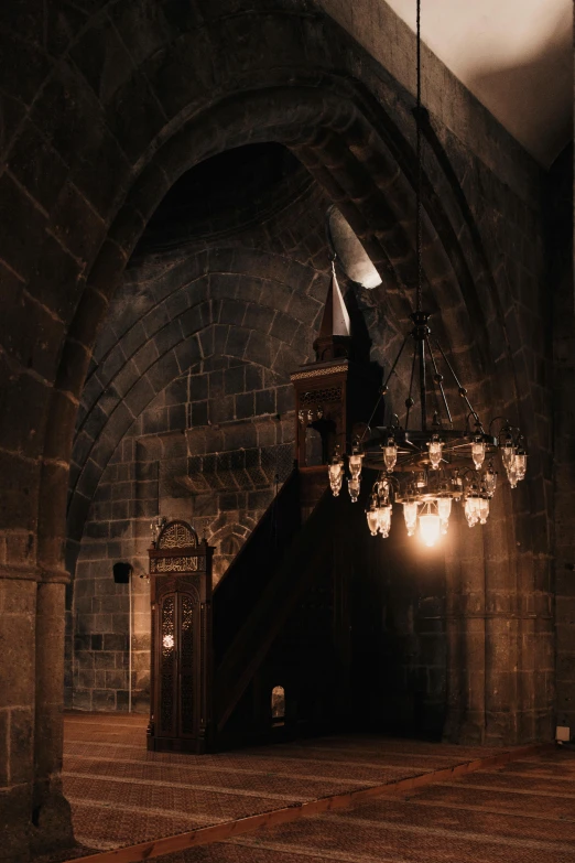 an old building is shown with light shining on the chandelier