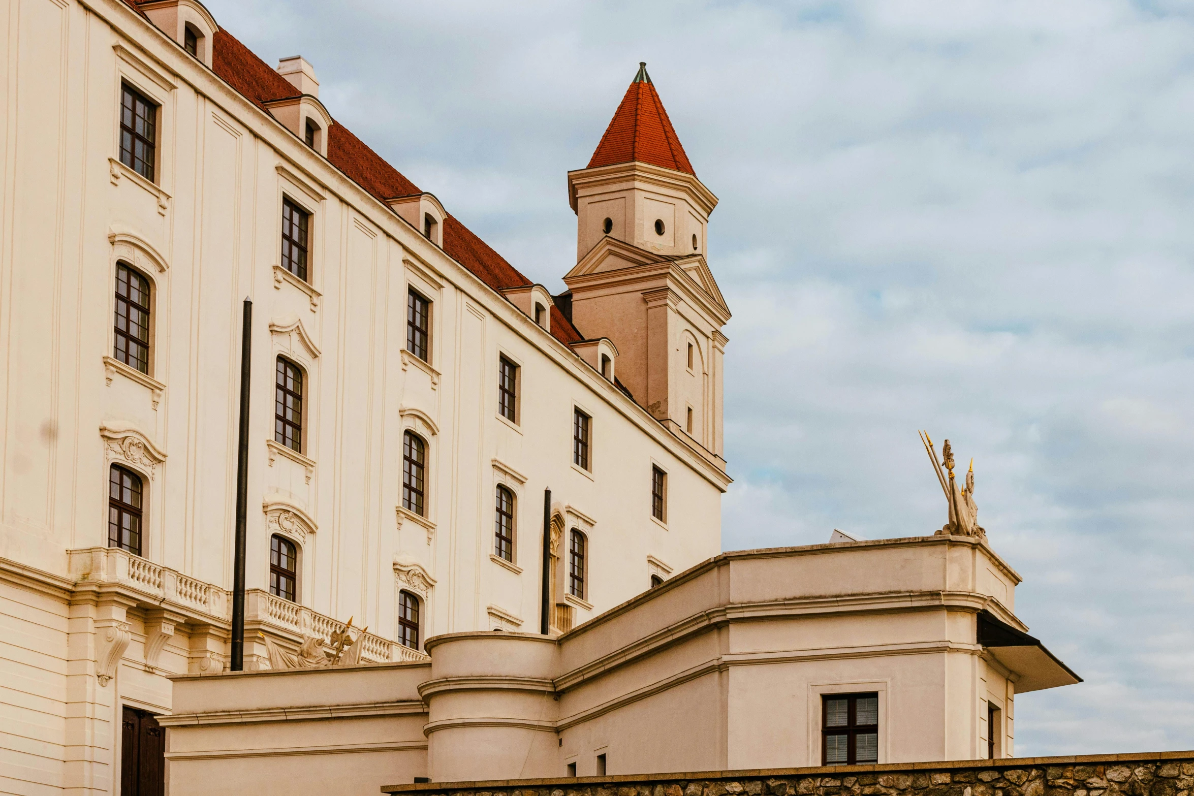 two story building with a clock at the top