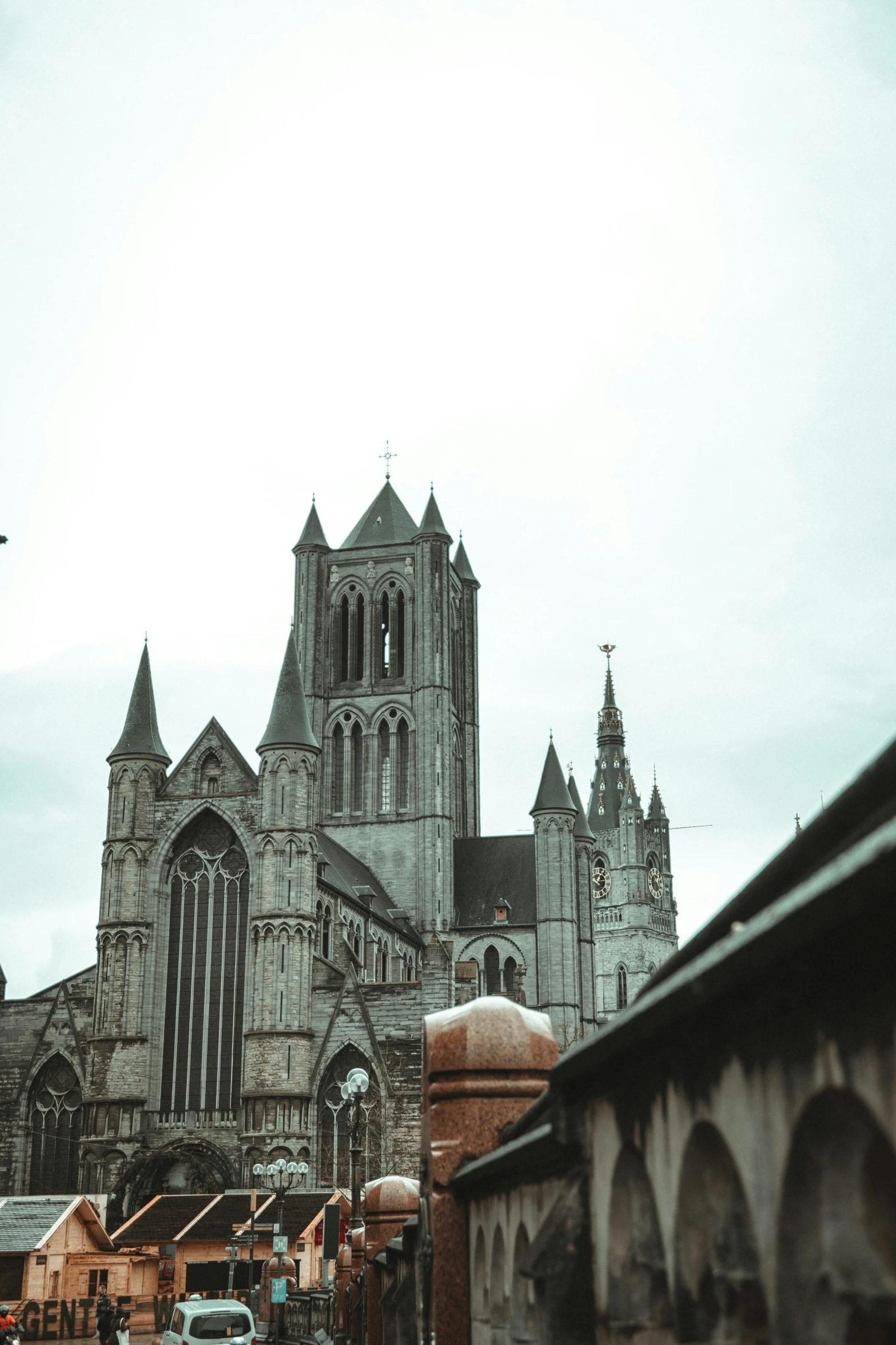 cathedral in old city area with cars driving near by