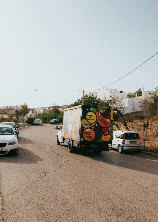 a couple of trucks that are parked in the road