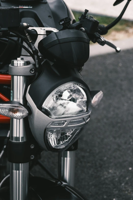 a motorcycle with headlight and a seat case sitting on the front