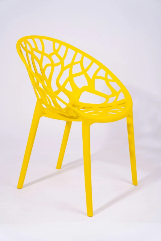 a yellow chair that is sitting on a table